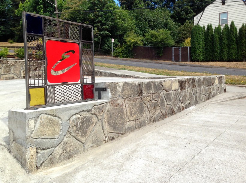 sign for a home business, Camas, WA Center is her laser cut powder coated initial. Box tube corner is filled with a variety of textures; perforated steel, expanded mesh and woven mesh.